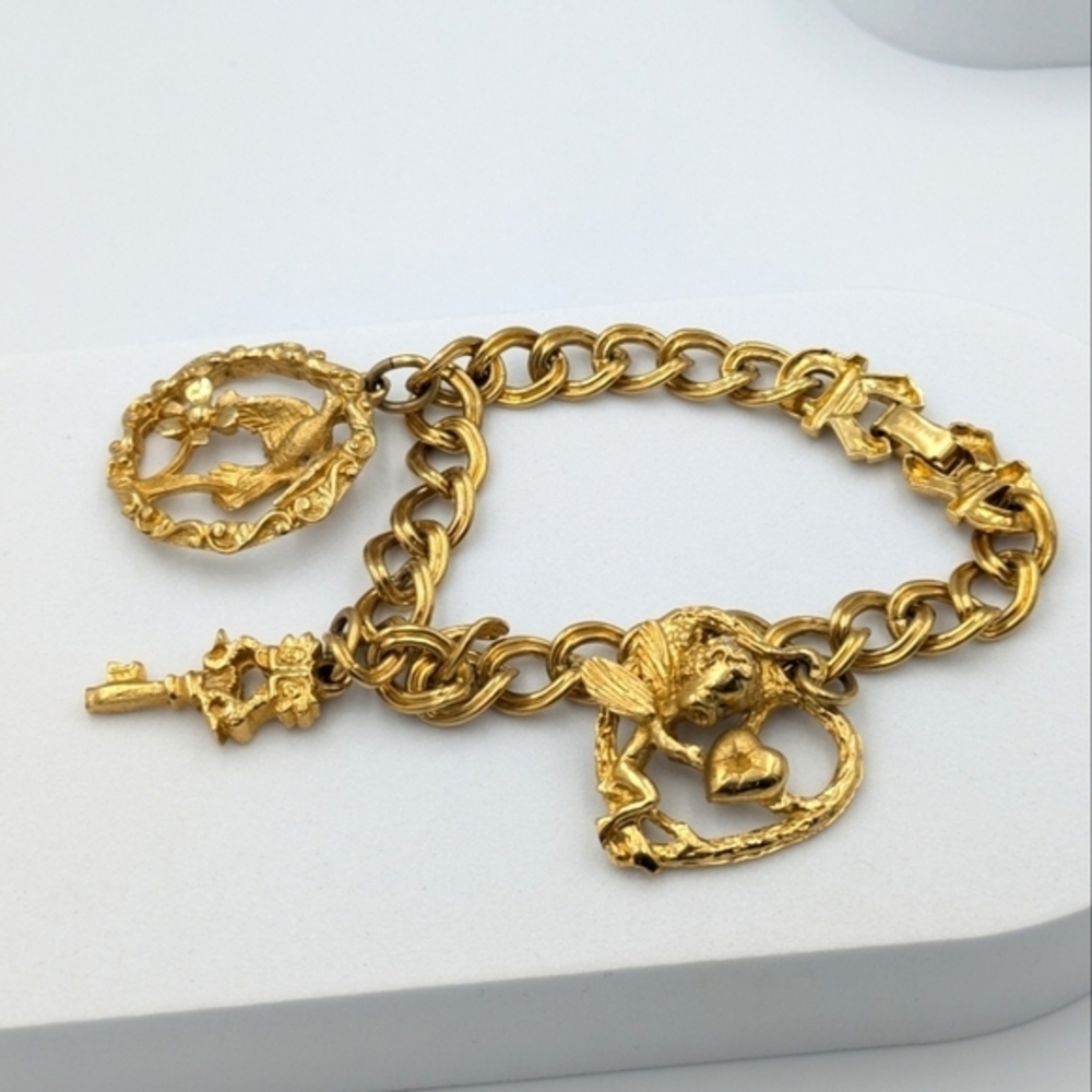 Vintage signed renoir gold tone charm chain bracelet